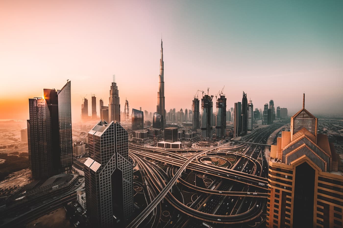 Dubai skyline at dawn, the Sheikh Zayed Road interchange in the foreground