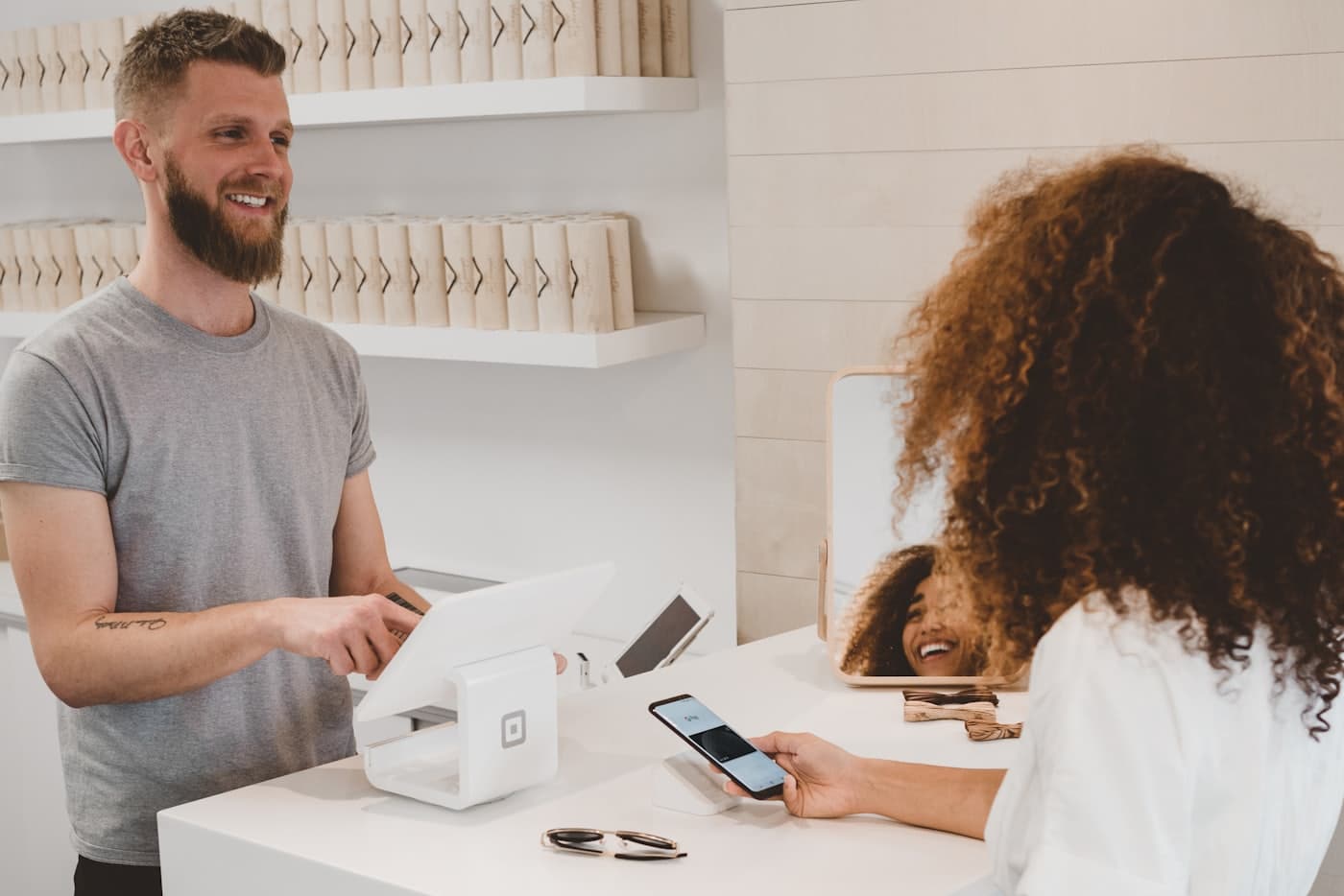 Customer paying at a retail counter