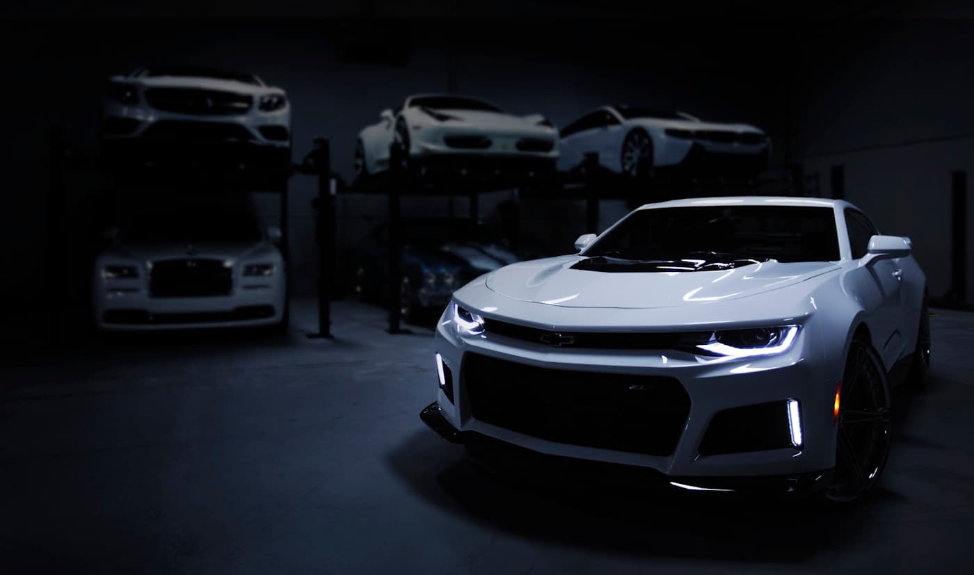 Cars in a dark showroom